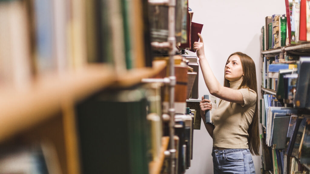 back-school-concept-with-woman-studying-library