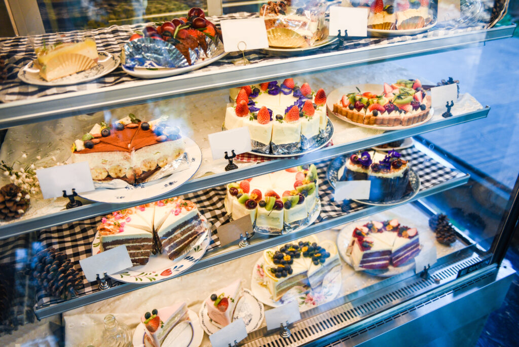 Cake on shelf with cake many variety on store bakery shop