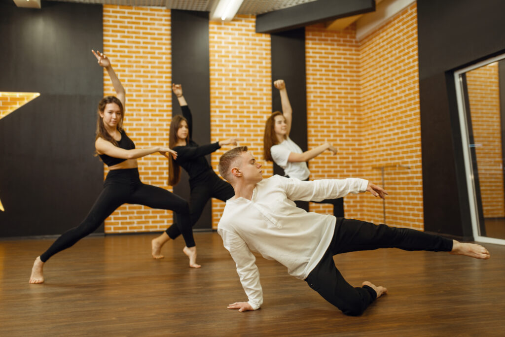 Contemporary dance performers posing in studio