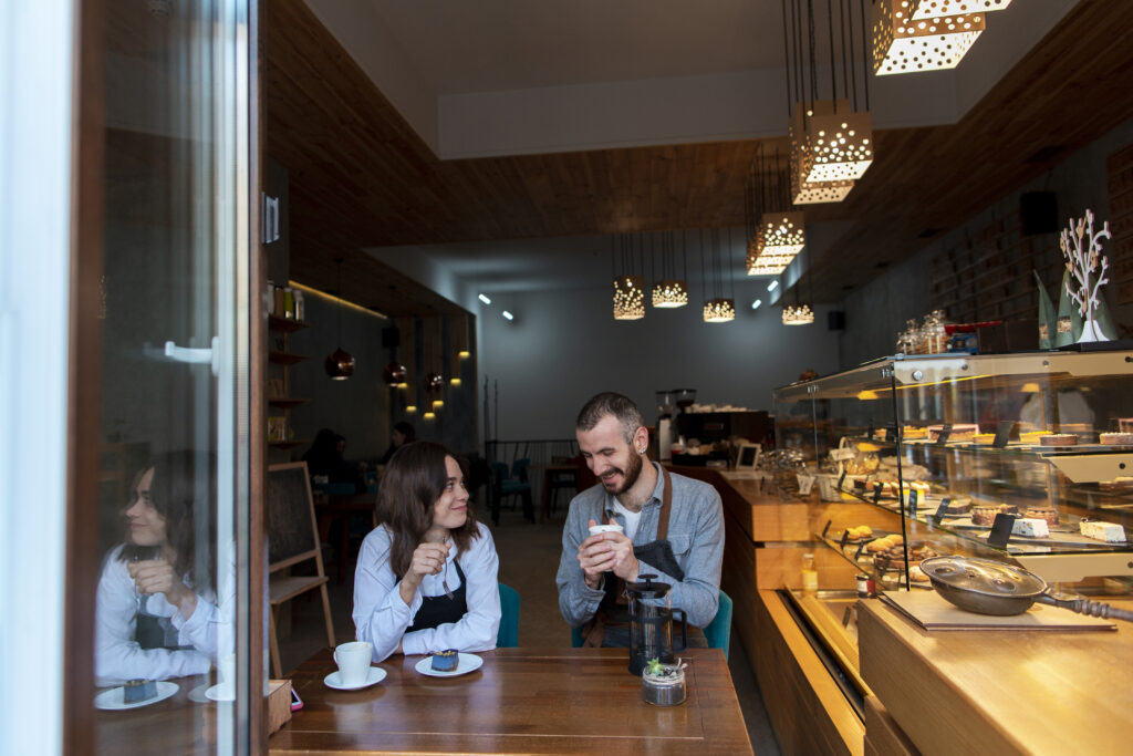couple-wearing-aprons-coffee-shop
