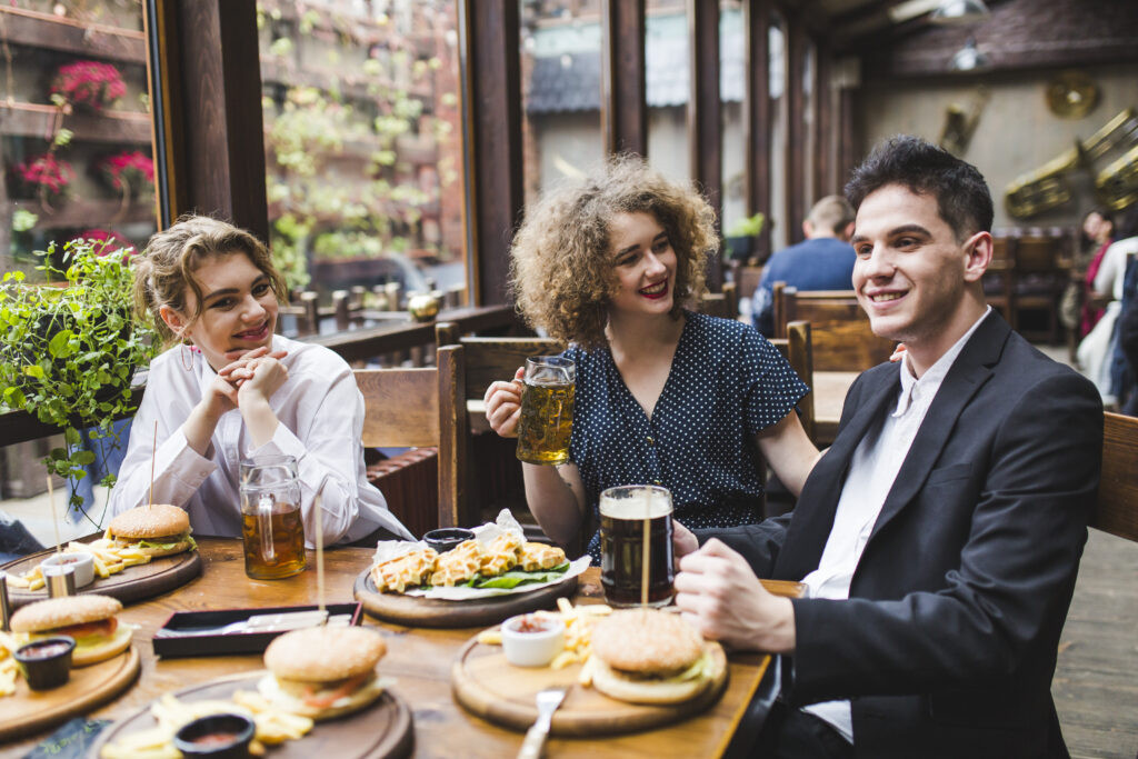 friends-eating-conversating-restaurant (1)