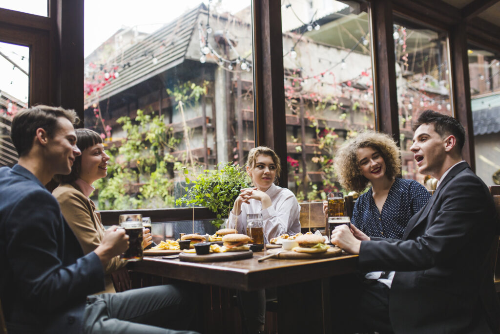 friends-eating-conversating-restaurant