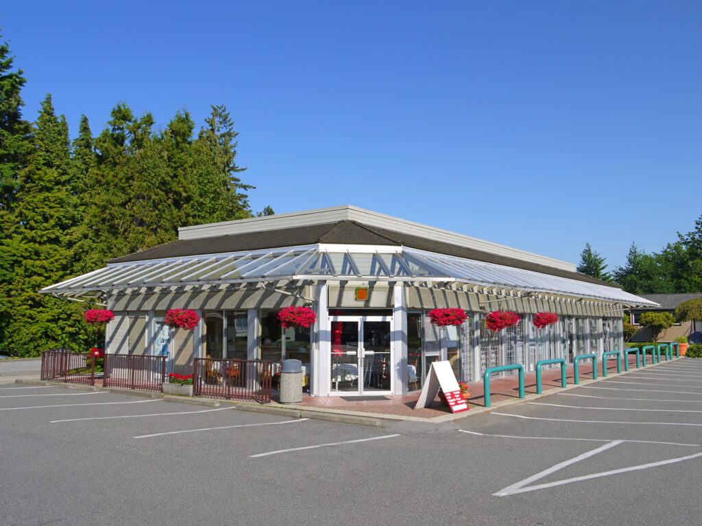 Main entrance of small cafe on a plaza