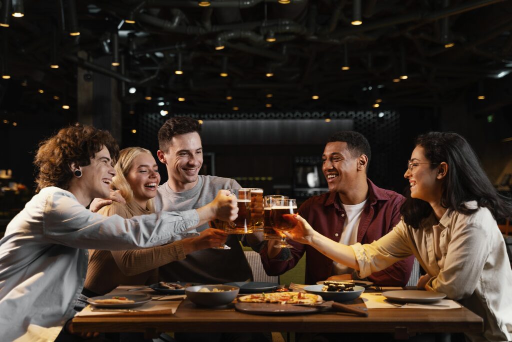 medium-shot-happy-friends-with-beer-mugs
