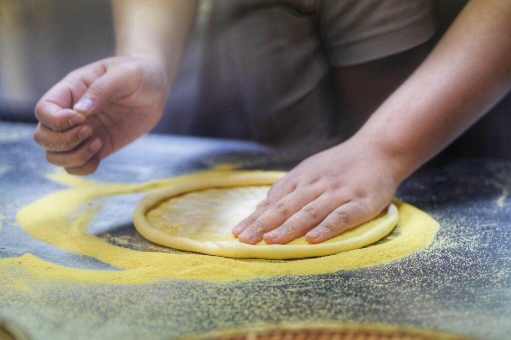 midsection-man-preparing-food-table