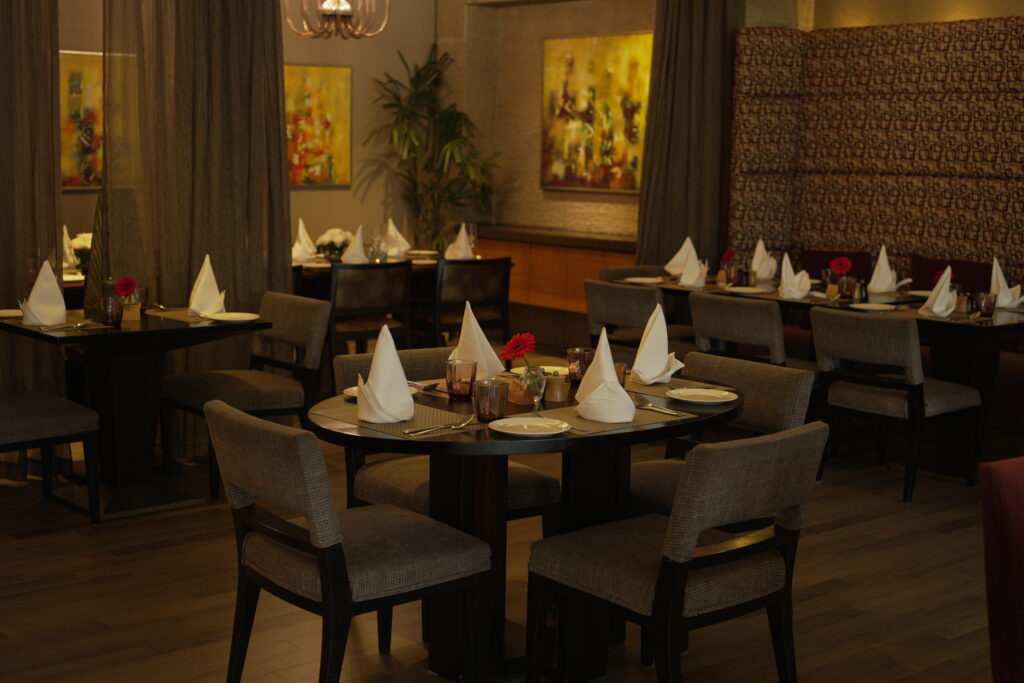 restaurant-with-table-chairs-with-large-painting-wall-it