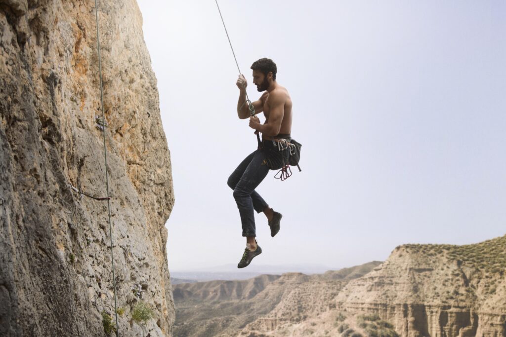 strong-man-climbing-mountain